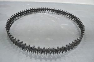 A sculpture by artist and sculptor G. Alexandridis. Glazed clay bodybuilders creating a fence. Ένα γλυπτό από τον εικαστικό και γλύπτη Γ. Αλεξανδρίδη.