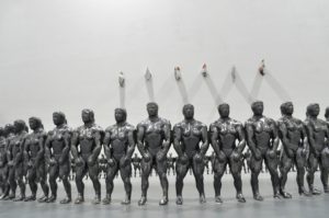 A sculpture by artist and sculptor G. Alexandridis. Glazed clay bodybuilders creating a fence. Ένα γλυπτό από τον εικαστικό και γλύπτη Γ. Αλεξανδρίδη.